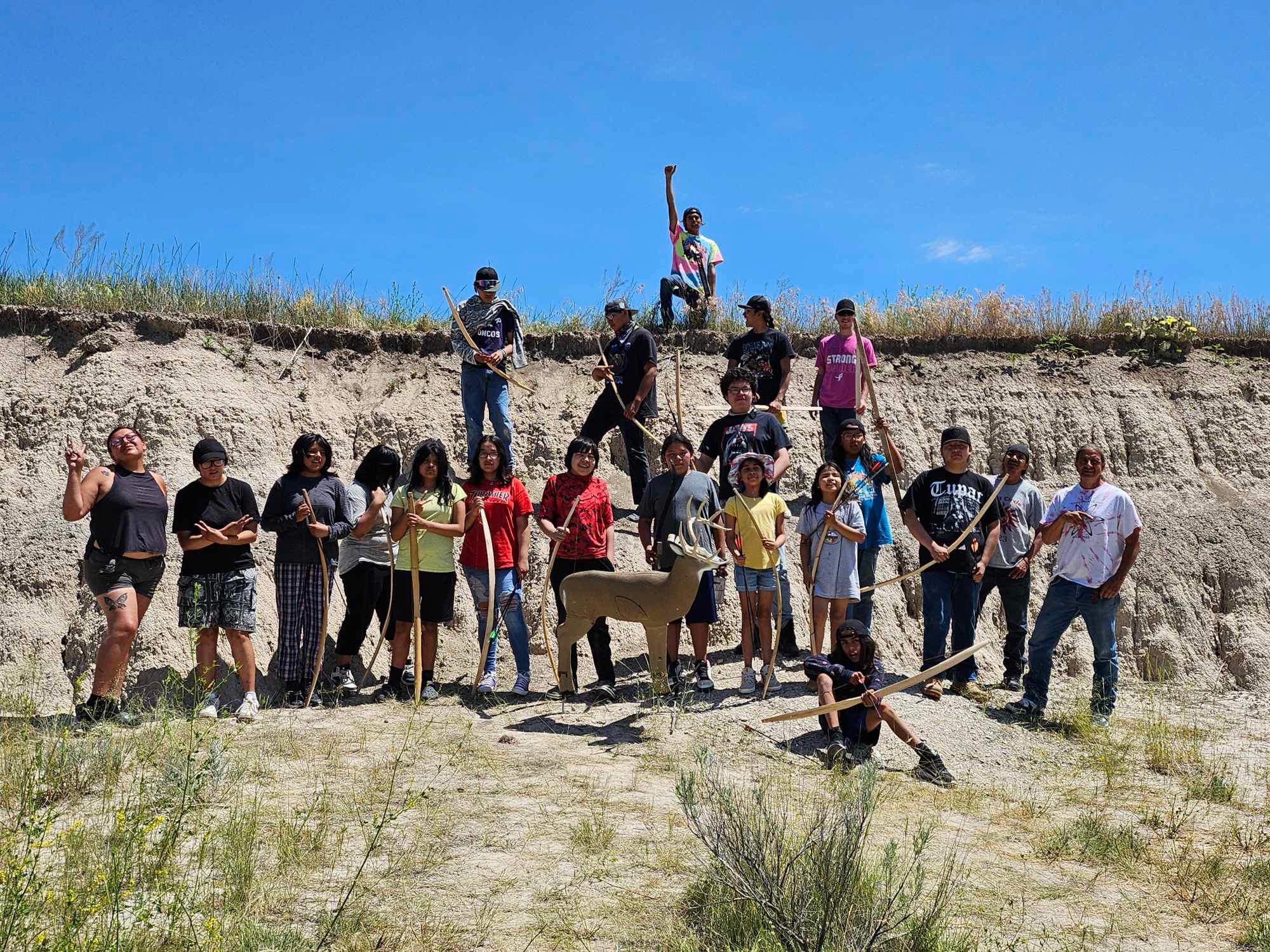 A group of young people standing together outside